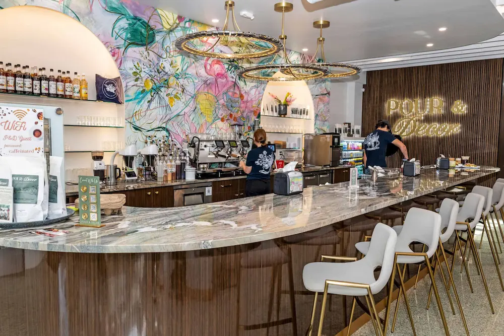 Coffee bar with locally painted mural at Pour and Decor cafe and retail store St Petersburg FL