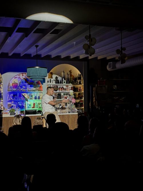 Don't Tell Comedy show hosted at pour and decor in St Pete. Shows a comedian making jokes